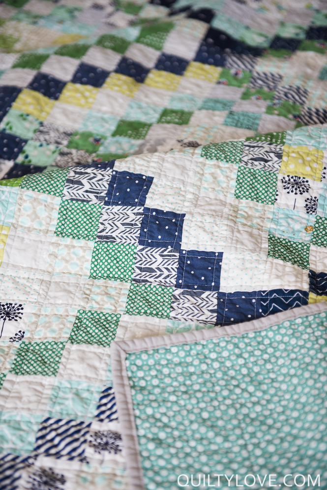 Scrappy trip around the world quilt quilted and made by emily of Quilty Love.