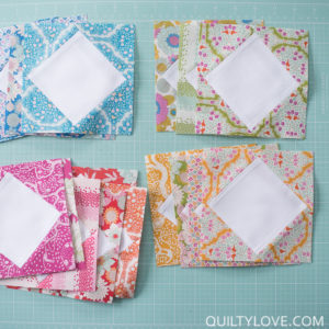 Lemontree fabric square in a square on aqua cutting mat