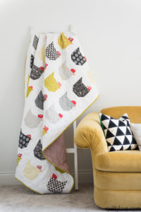 chicken quilt by emily of quiltylove hanging on quilt ladder