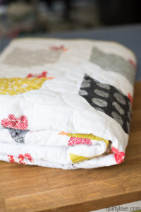 chicken quilt folded on table