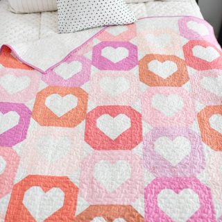 Happy Monday!  Finally took some photos of this second #classicheartsquilt sample. 🤍🤍🤍 It's a little softer using Ruby Star Society Basics. 
⠀⠀⠀⠀⠀⠀⠀⠀⠀
👉🏻👉🏻👉🏻 Join us for the sew along that starts a week from today!  Comment HEARTQAL and I'll send you a link to sign up for the sew along. 
⠀⠀⠀⠀⠀⠀⠀⠀⠀
I've got some fun prizes lined up plus this is a fairly easy quilt that we will sew together over 5 weeks. 
⠀⠀⠀⠀⠀⠀⠀⠀⠀
Quilt Pattern:  Classic Hearts - in the shop
Fabrics:  Assorted @rubystarsociety basics
Quilted on my Janome MC6700p
⠀⠀⠀⠀⠀⠀⠀⠀⠀
#quiltylove #quiltylovepatterns #heartquilt #quiltyloveheartquilt #quilting #modernquilting #quiltersofinstagram #quiltingismytherapy #quiltingismyfavorite #modernquilt #quiltpattern #quiltalong #quiltalong2023 #sewalong #sewalong2023 #letssewalong #letssewtogether
