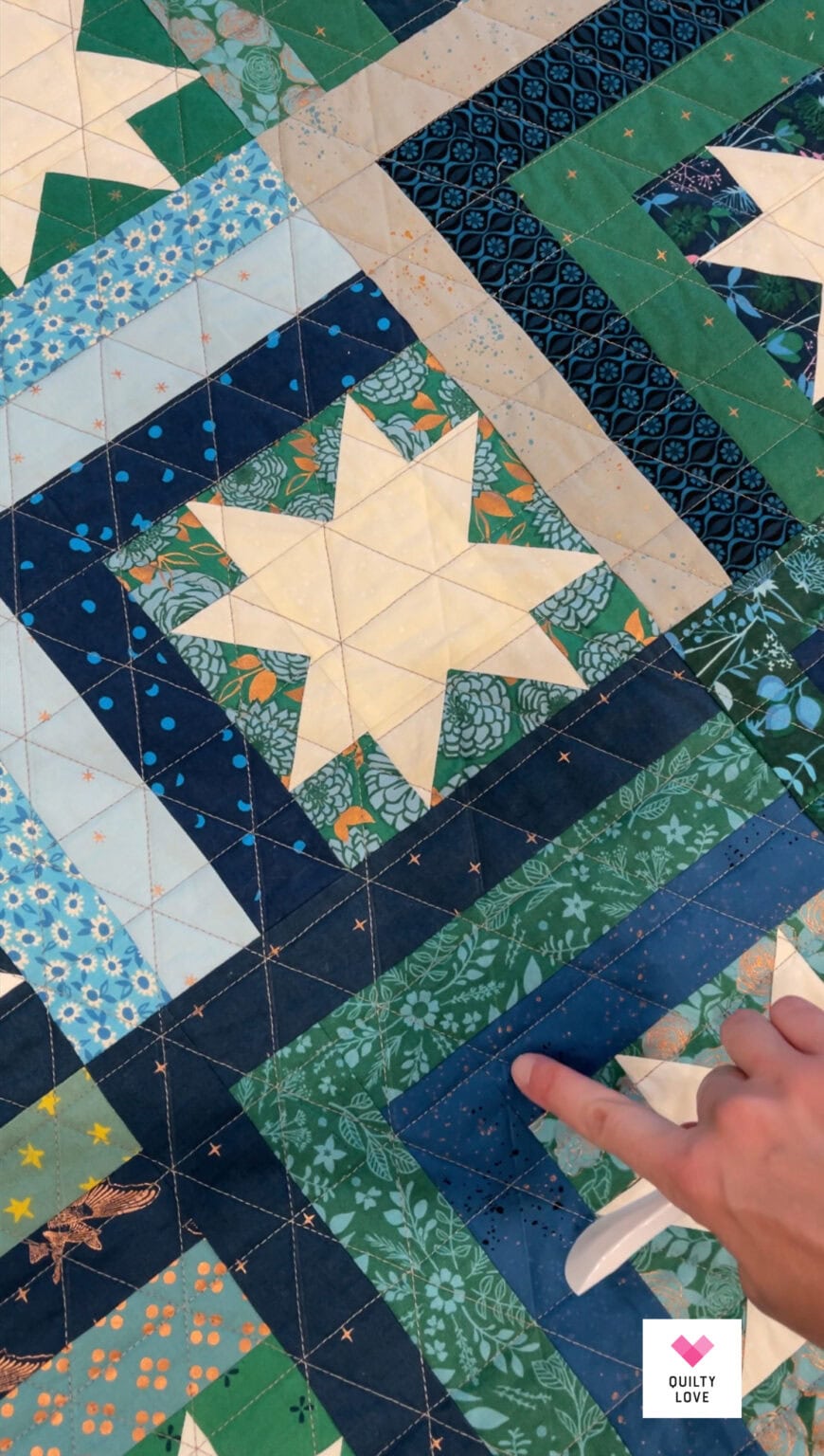 Scrappy Log Cabin Stars quilt - Quilty Love