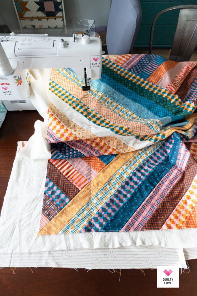 Vibrant patchwork quilt with various patterns and colors for cozy home decor.
